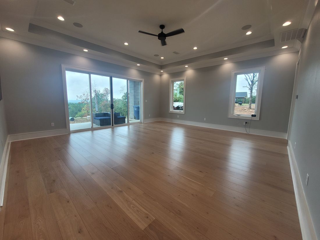 Completed Custom Residence Great Room Coffered Tray Ceiling and Glass Sliders