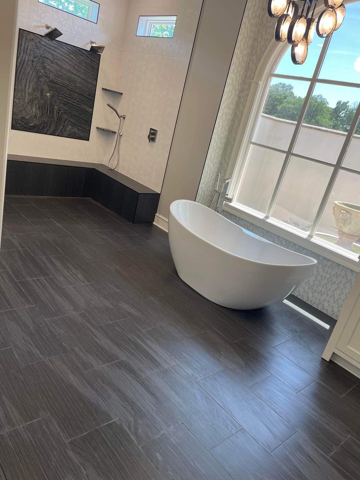 Completed Custom Estate Arched-Window Soaking Tub and Bookmatched Stone Wet Room