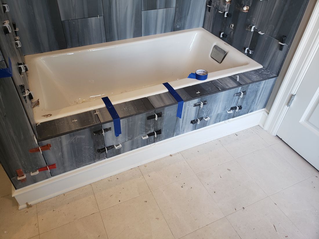 Stage 8 Large-Format Marble Tile Laid with Leveling Clips