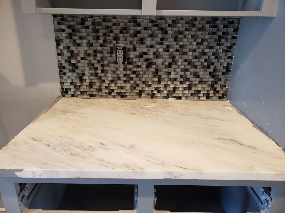 Stage 9 Veined Stone Countertop and Glass Mosaic Backsplash Installation