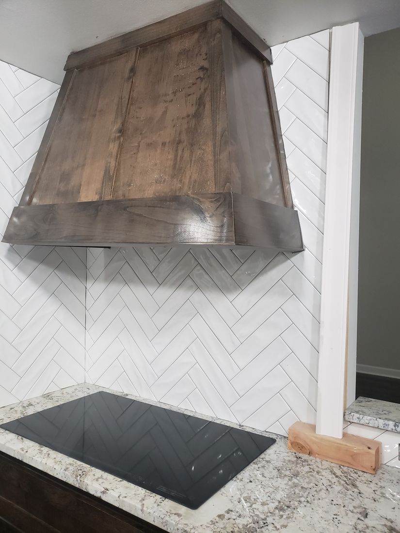 Stage 10 Custom Stained Wood Range Hood and Herringbone Tile